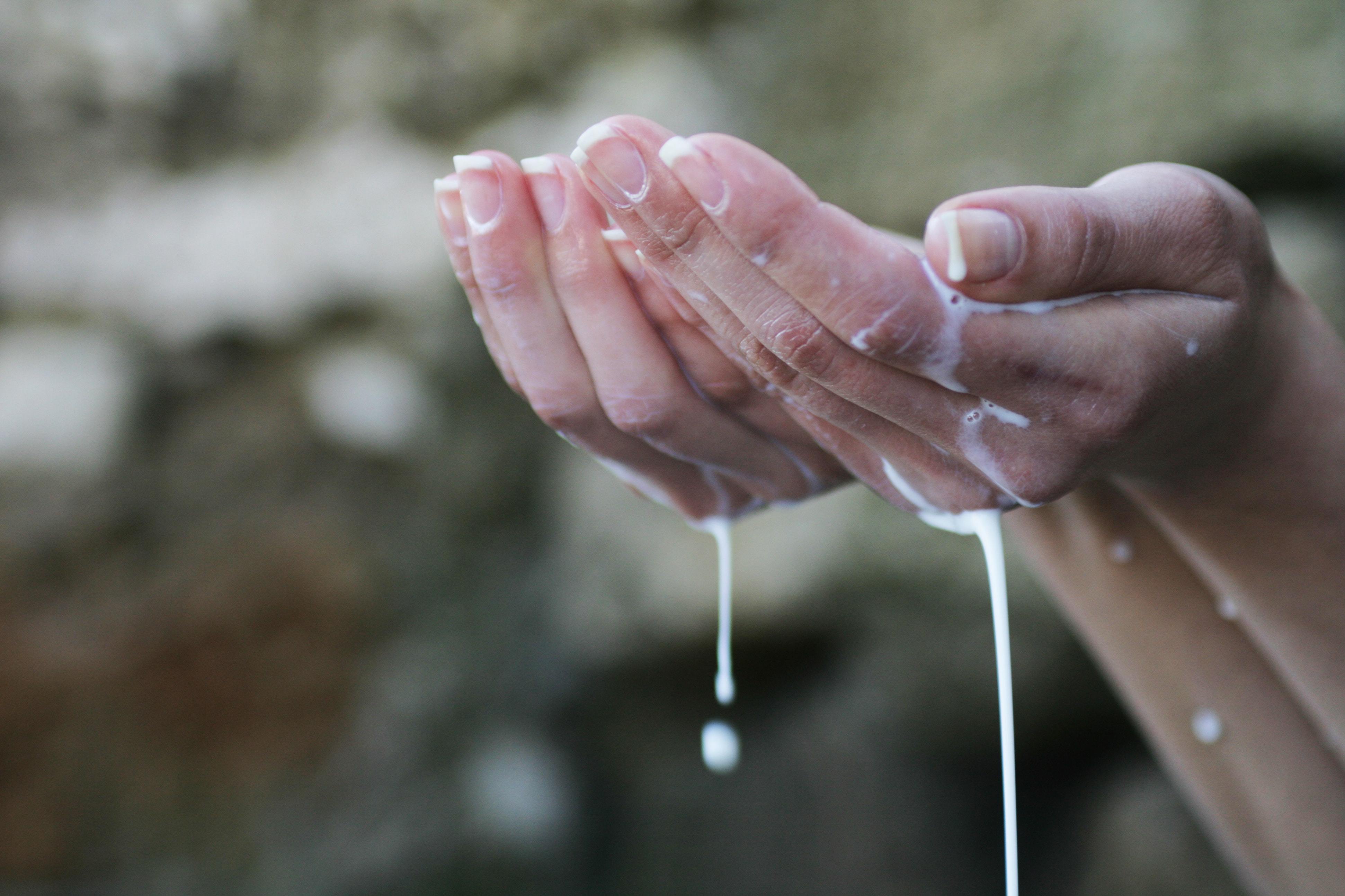 Hands lathered in body wash