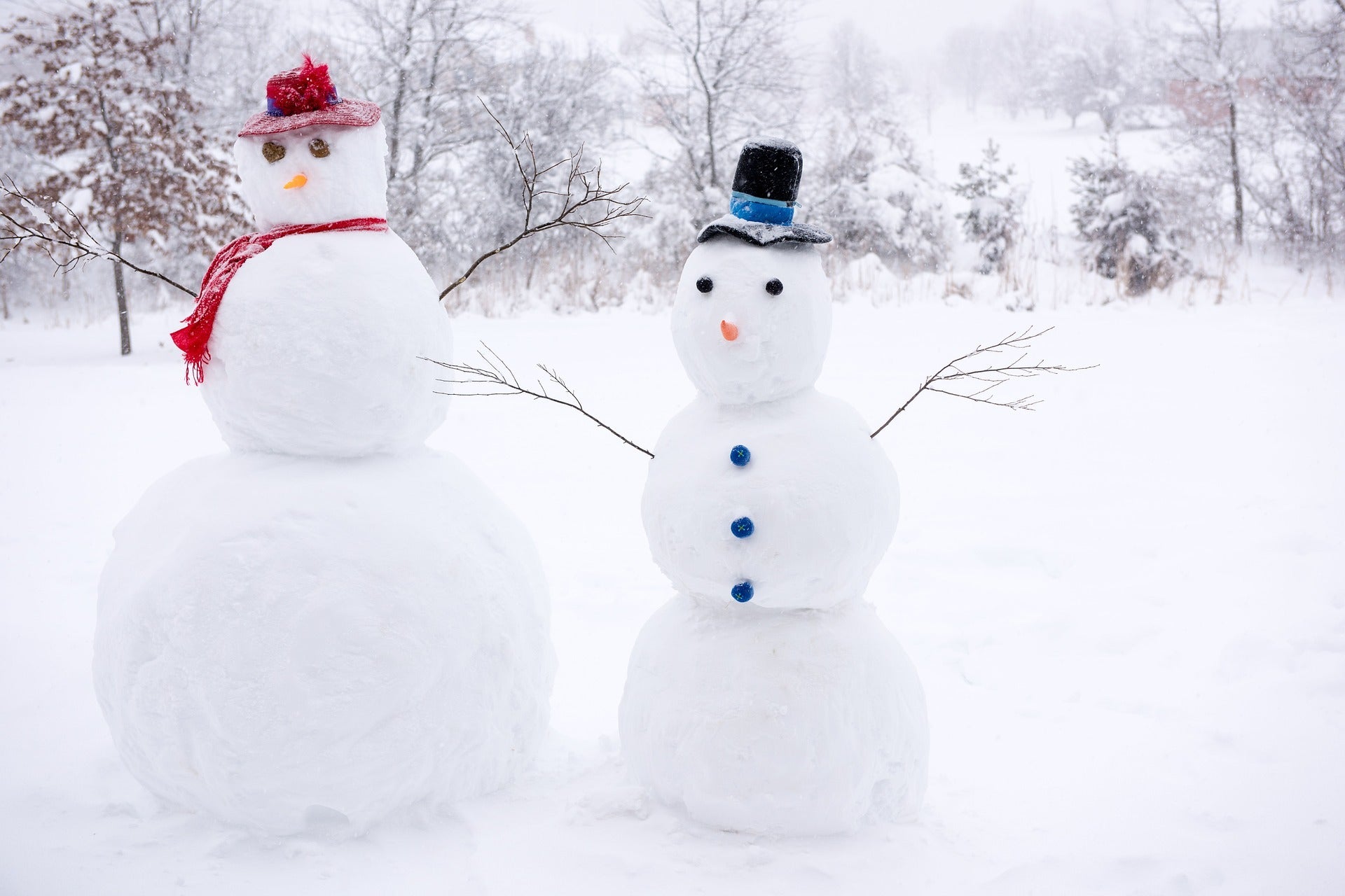 Making Snowmen at an Outdoor Winter Party